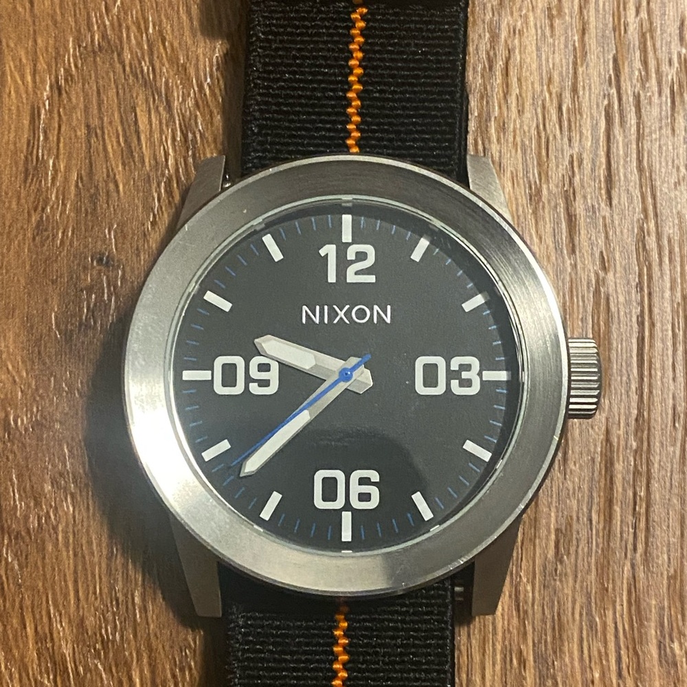 Nixon Black and Silver Watch with Blue and Orange Details